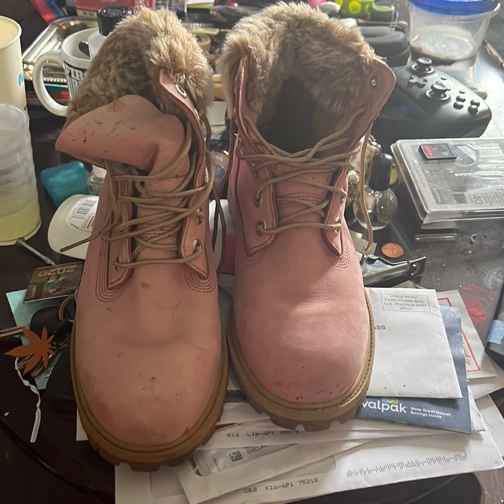 Pink timberland boots with fur worn